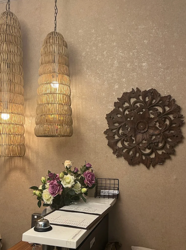 Rattan pendant lights and carved mandala wall art