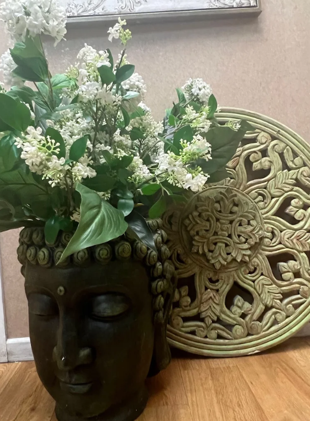 Buddha head planter with flowers - zen decor