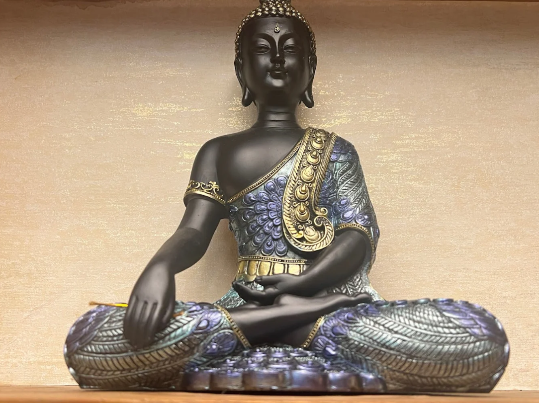 Traditional Thai Buddha statue with gold and blue details